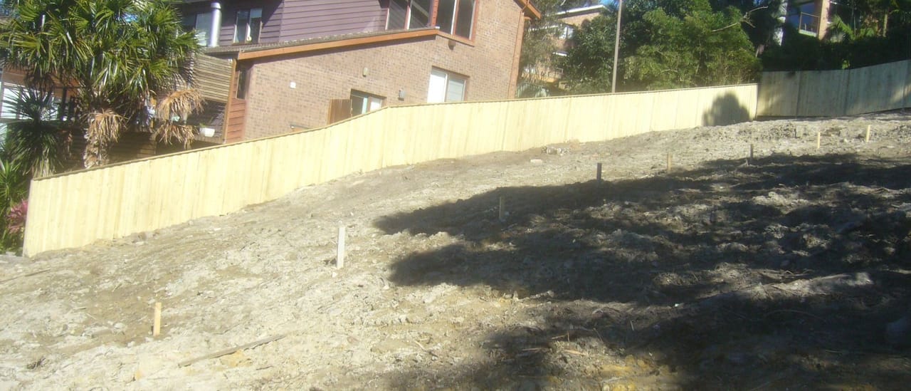 Treated pine timber fence enclosing a freshly cleared and levelled block in Sydney